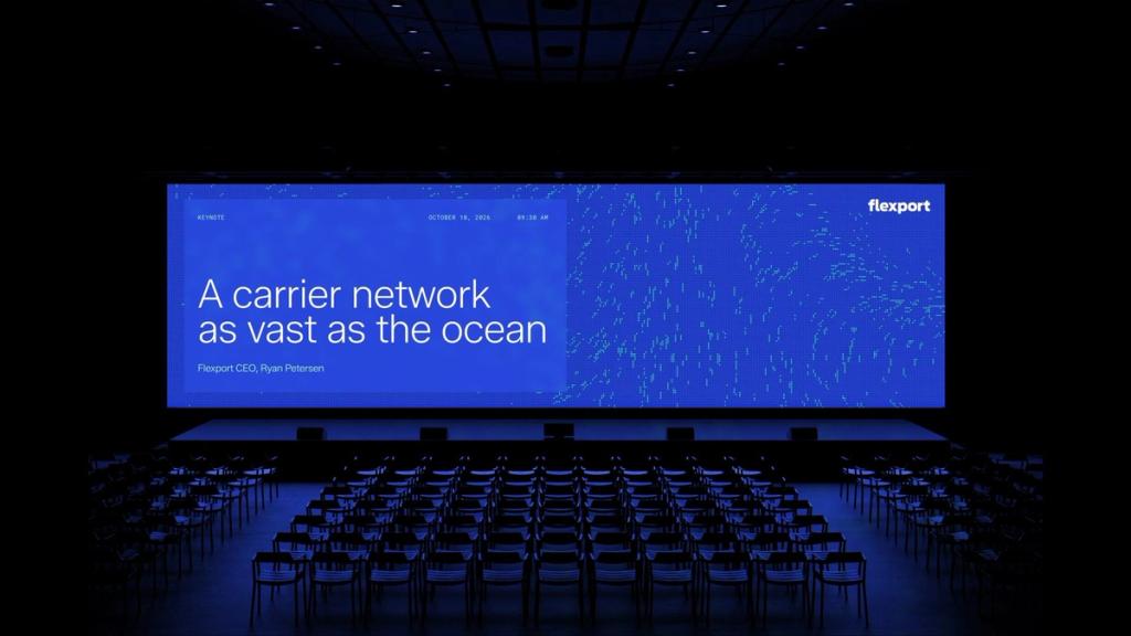 Flexport presentation slide displayed on a cinema screen titled "A carrier network as vast as the ocean."
