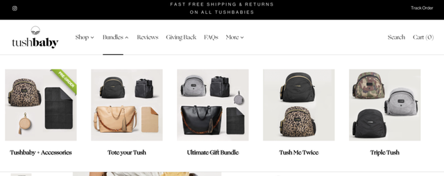 Tushbaby ecommerce homepage showing product bundles of baby carriers and bags