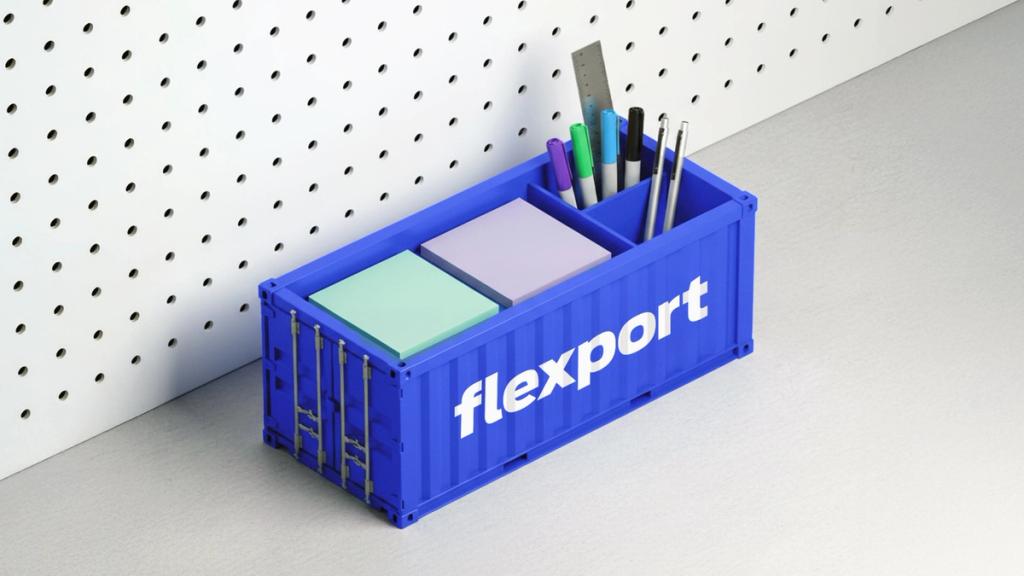 Flexport shipping container holds sticky notes and writing implements.