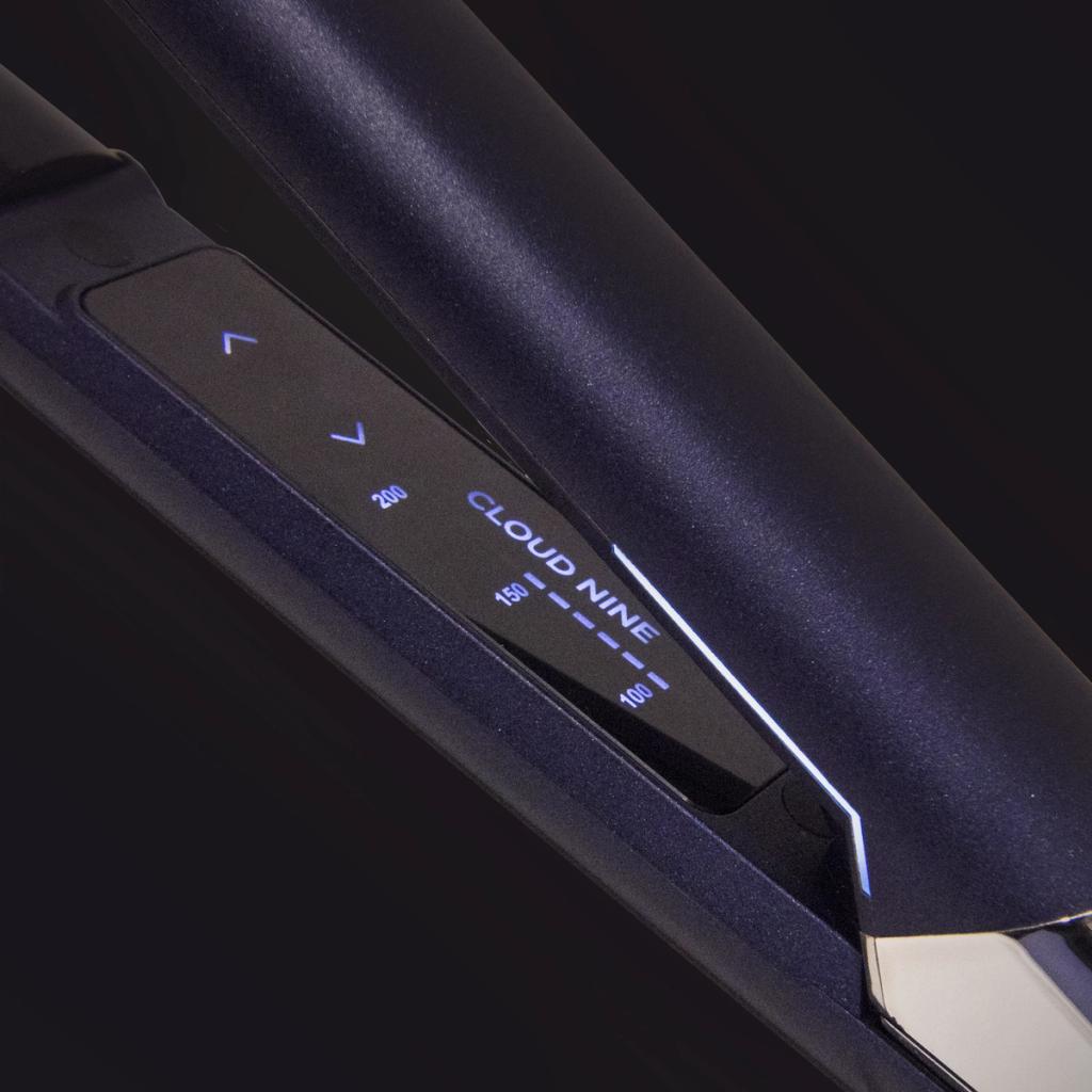 Close-up of a Cloud Nine hair straightener showing illuminated temperature controls