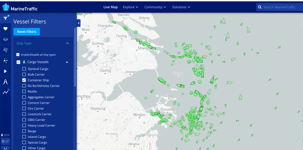 MarineTraffic live map screenshot showing green cargo ship icons clustered around Shanghai and Ningbo
