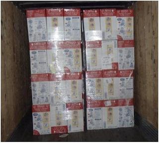 Photo of a floor-loaded FCL container with shrink-wrapped product cartons stacked neatly in blocks directly on the container floor