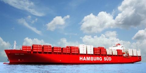 Red Hamburg Sud container ship Monte Rosa sailing on calm blue sea under a cloudy sky