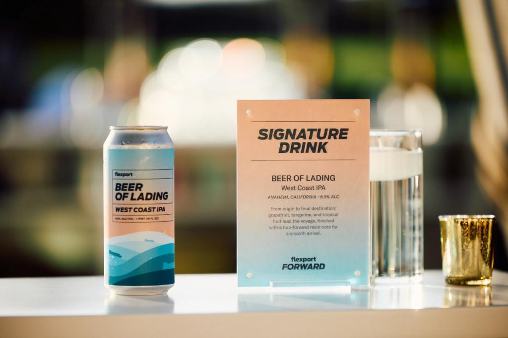 Flexport Forward signature drink card for Beer of Lading West Coast IPA beside a branded beer can and glass