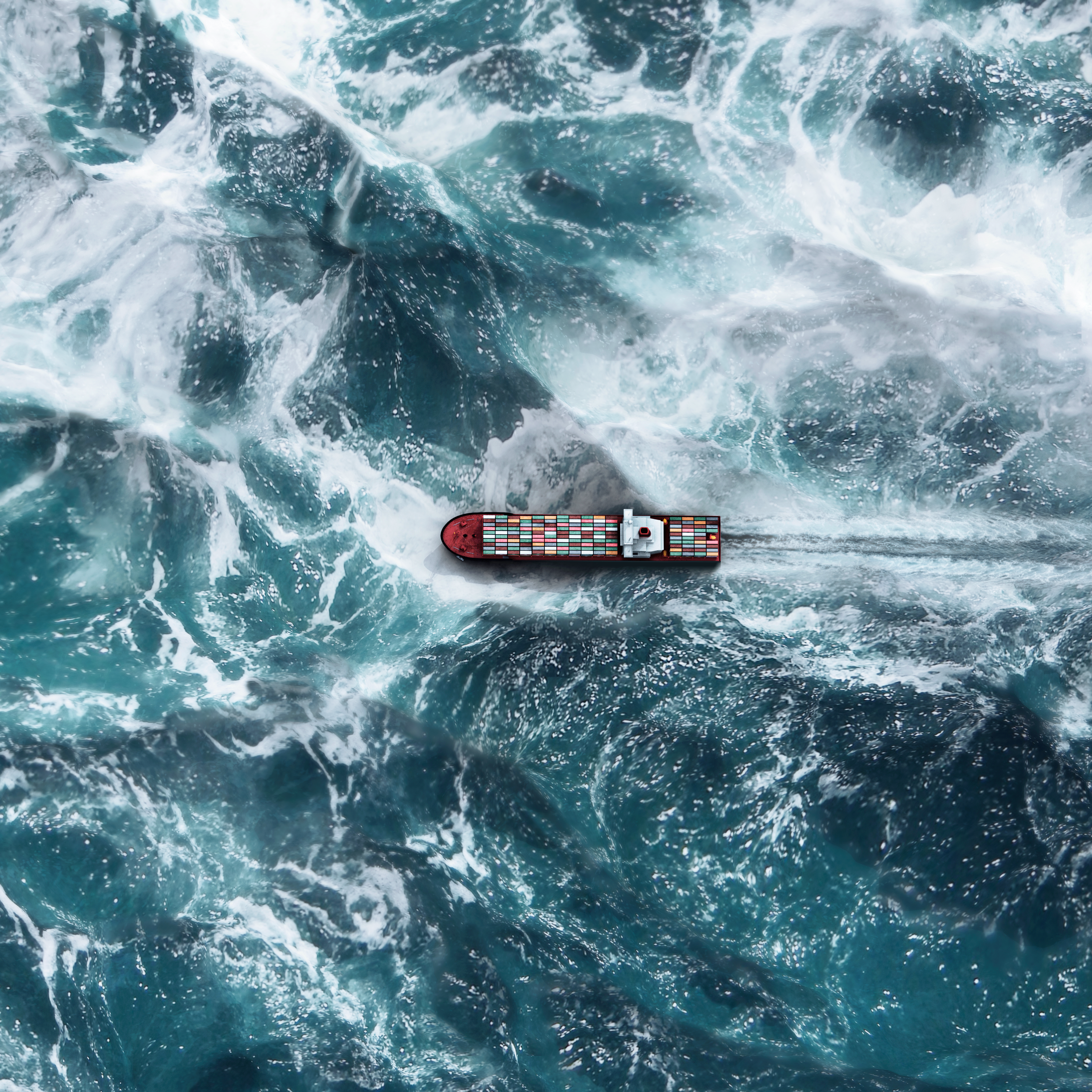 Container ship navigating through rough ocean waves.