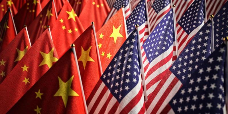 Rows of small Chinese and American flags arranged side by side