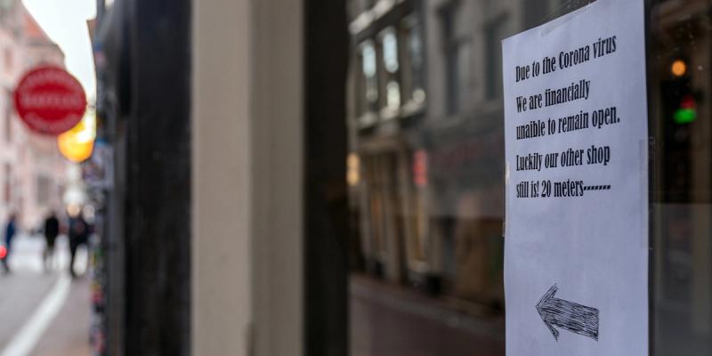 Handwritten shop sign reads: Due to the Corona virus we are financially unaible to remain open