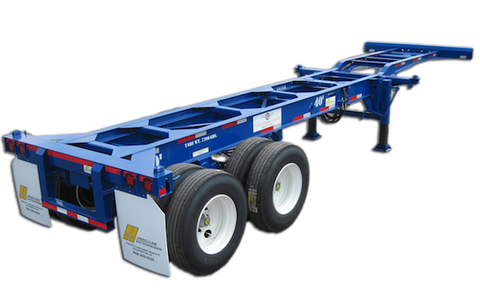 Empty blue intermodal container chassis trailer with tandem rear axles, dual tires, mud flaps, and folding front landing gear.