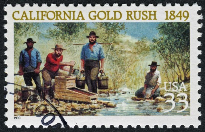 Postage stamp "California Gold Rush 1849" showing prospectors panning for gold at a stream