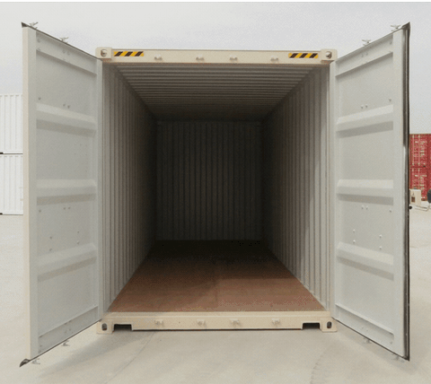An empty shipping container with both rear doors open, showing the bare wooden floor and corrugated steel interior ready for loading.