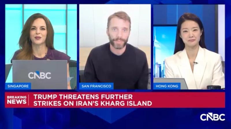 CNBC breaking-news broadcast still with three panelists in Singapore, San Francisco and Hong Kong; chyron reads Trump threatens further strikes on Iran's Kharg Island