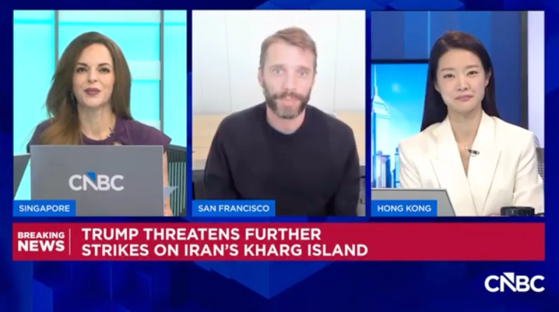 CNBC breaking-news broadcast still with three panelists in Singapore, San Francisco and Hong Kong; chyron reads Trump threatens further strikes on Iran's Kharg Island