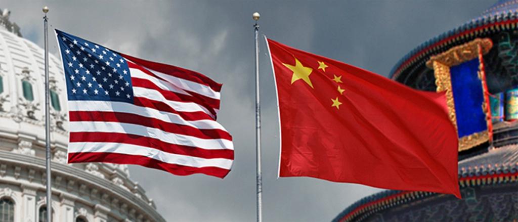 US and Chinese flags flying on poles before the US Capitol dome and a Chinese temple