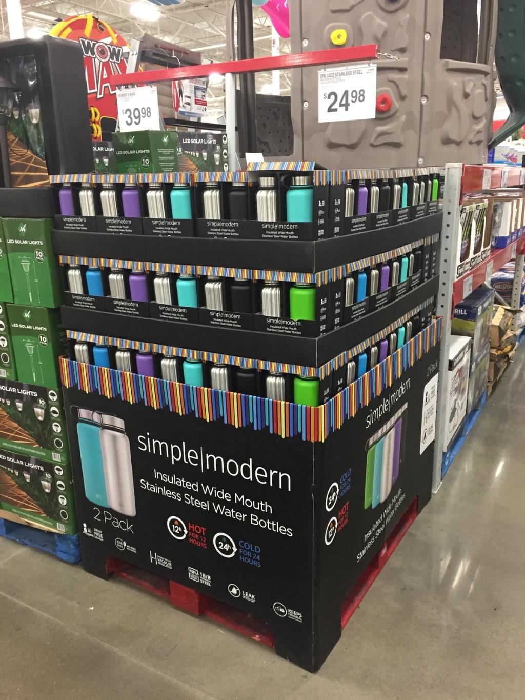 Retail pallet display of Simple Modern insulated water bottle 2-packs in a warehouse store aisle