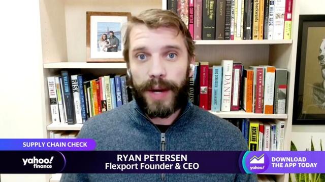 Yahoo Finance video still: Flexport founder and CEO Ryan Petersen in a remote interview with a bookshelf behind him