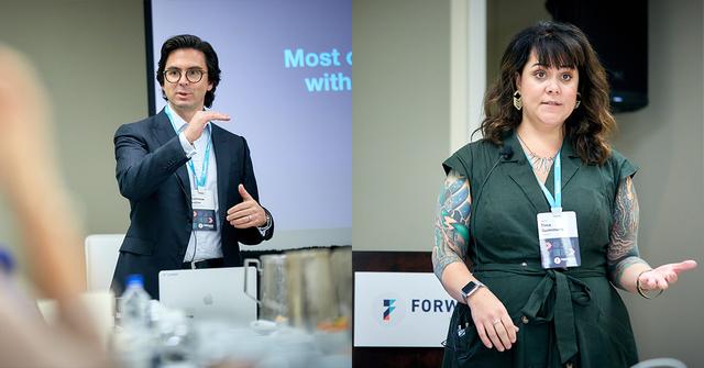 Two FORWARD conference speakers presenting, a man in a suit and a woman in green, beside event branding