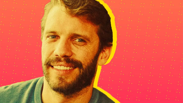 Smiling bearded man's headshot against a pink halftone background with a yellow accent outline