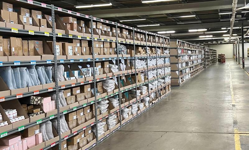 Chicago fulfillment center aisle lined with shelving bins of small packaged goods