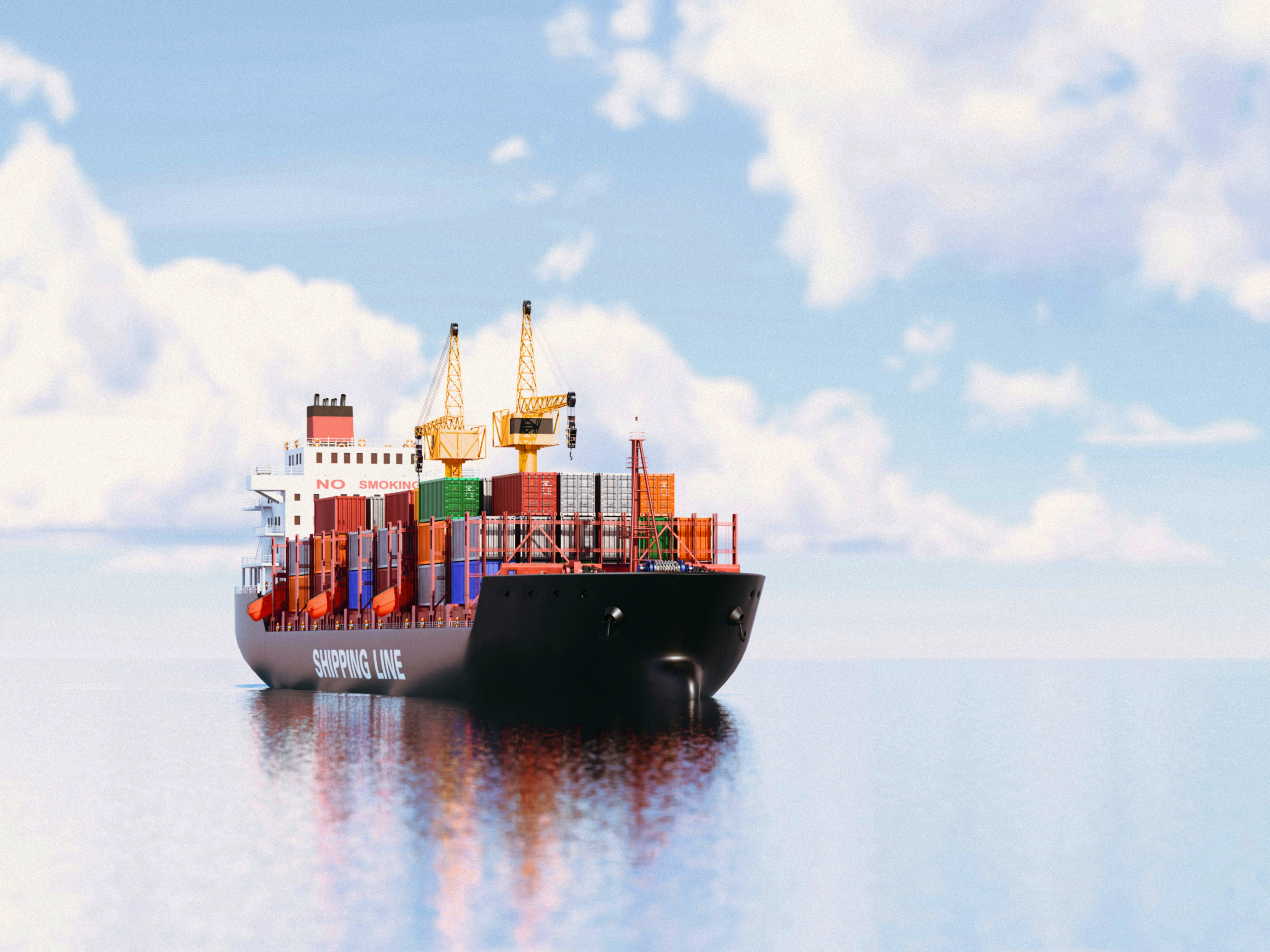 A cargo ship loaded with shipping containers travels across calm water.