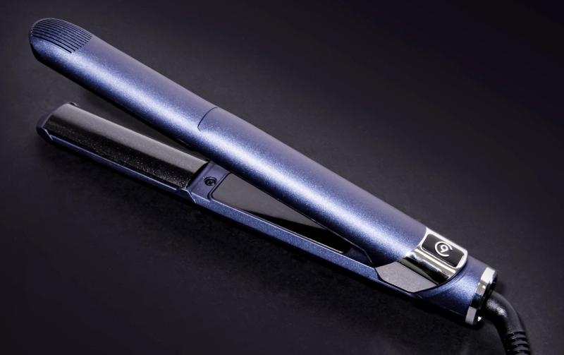 Cloud Nine metallic blue hair straightener on a black background