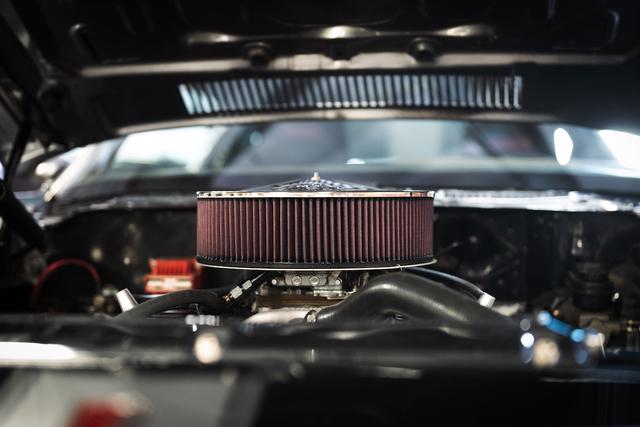K&N performance air filter mounted on the engine of a vehicle under an open hood