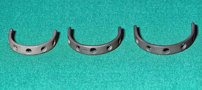 Three curved titanium support rings for the trachea.
