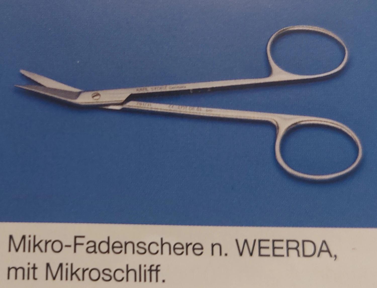 Fine curved suture scissors with a micro-serrated tip.