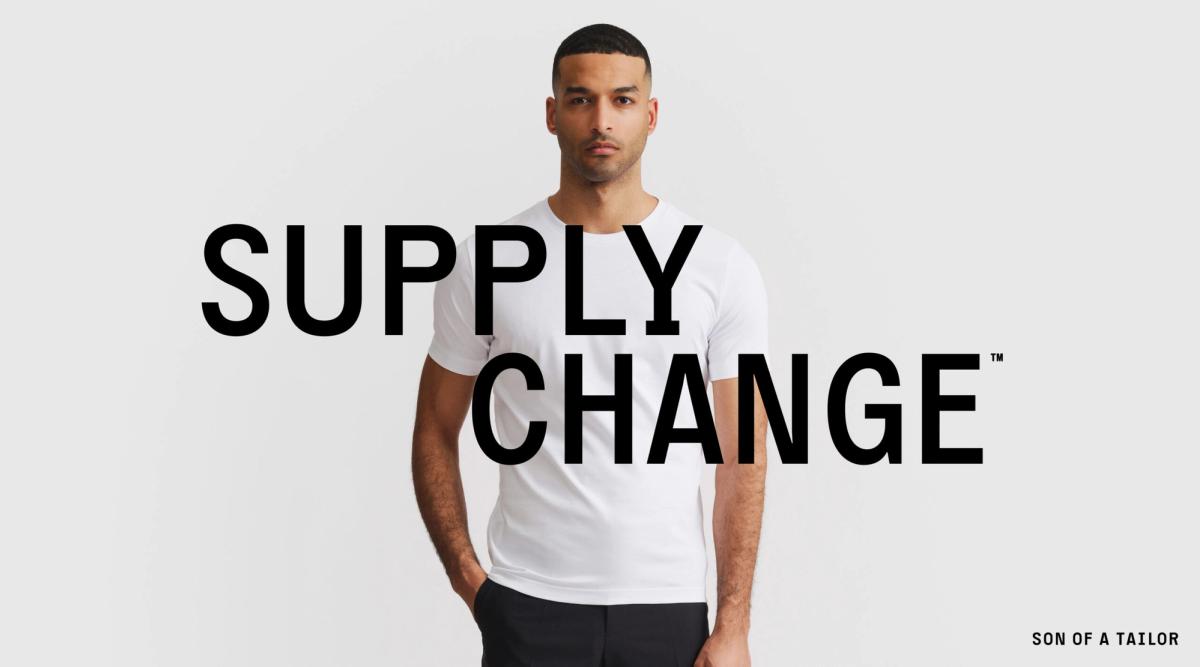 Image of male in Son of a Tailor shirt, with the phrase supply change written across.
