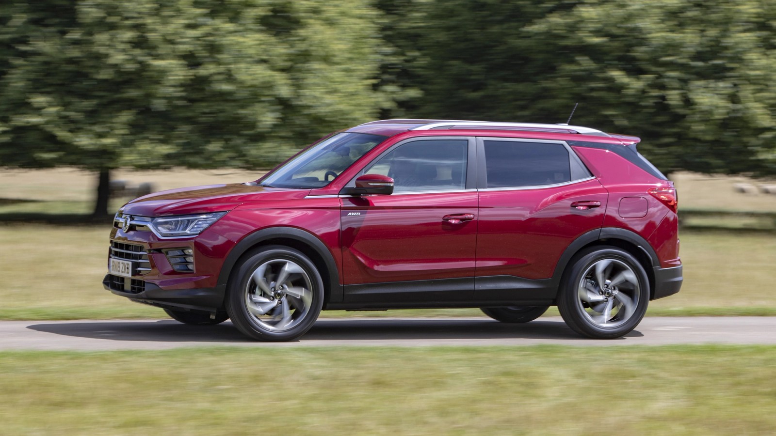 Red SsangYong Korando front driving