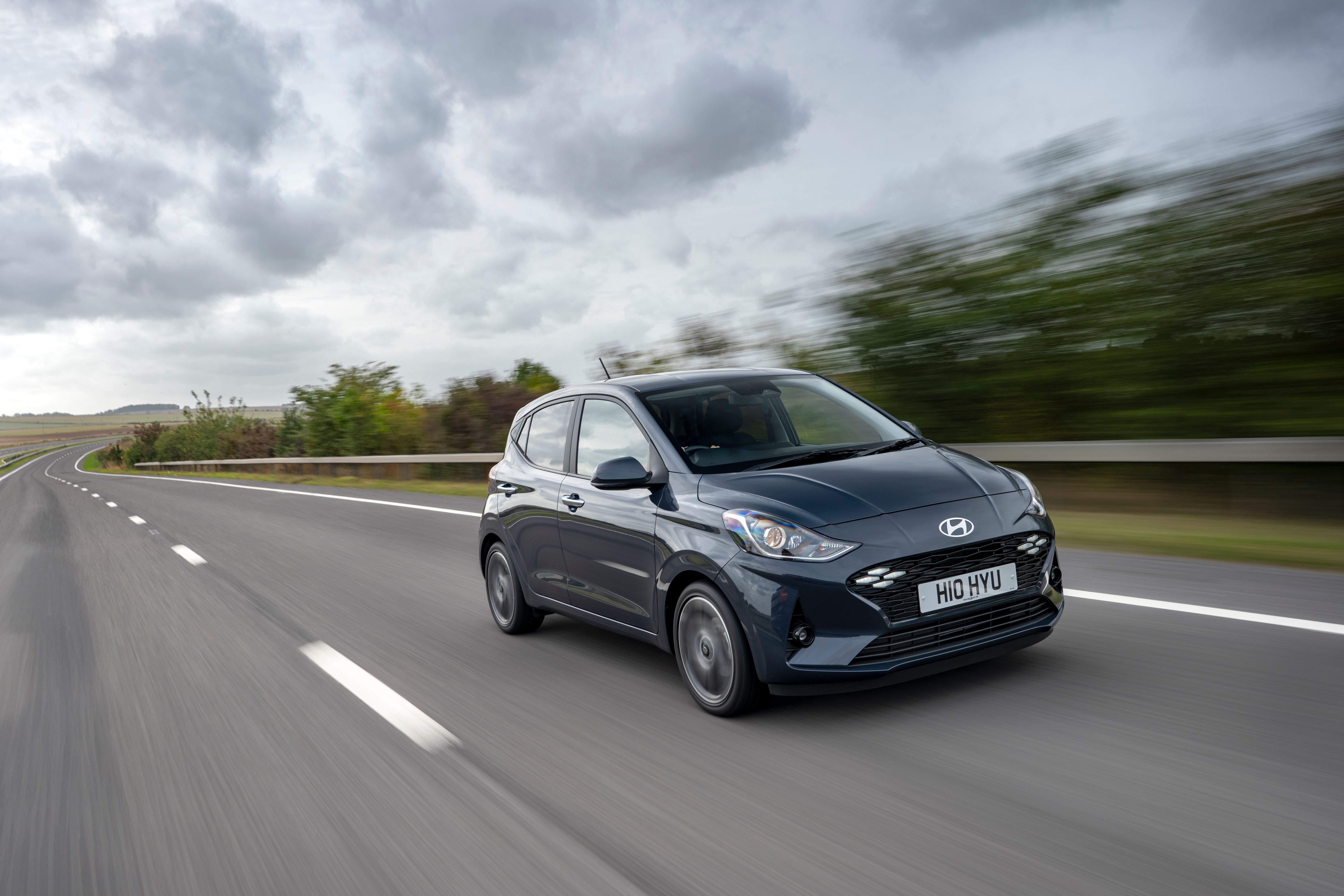 Grey Hyundai i10 driving