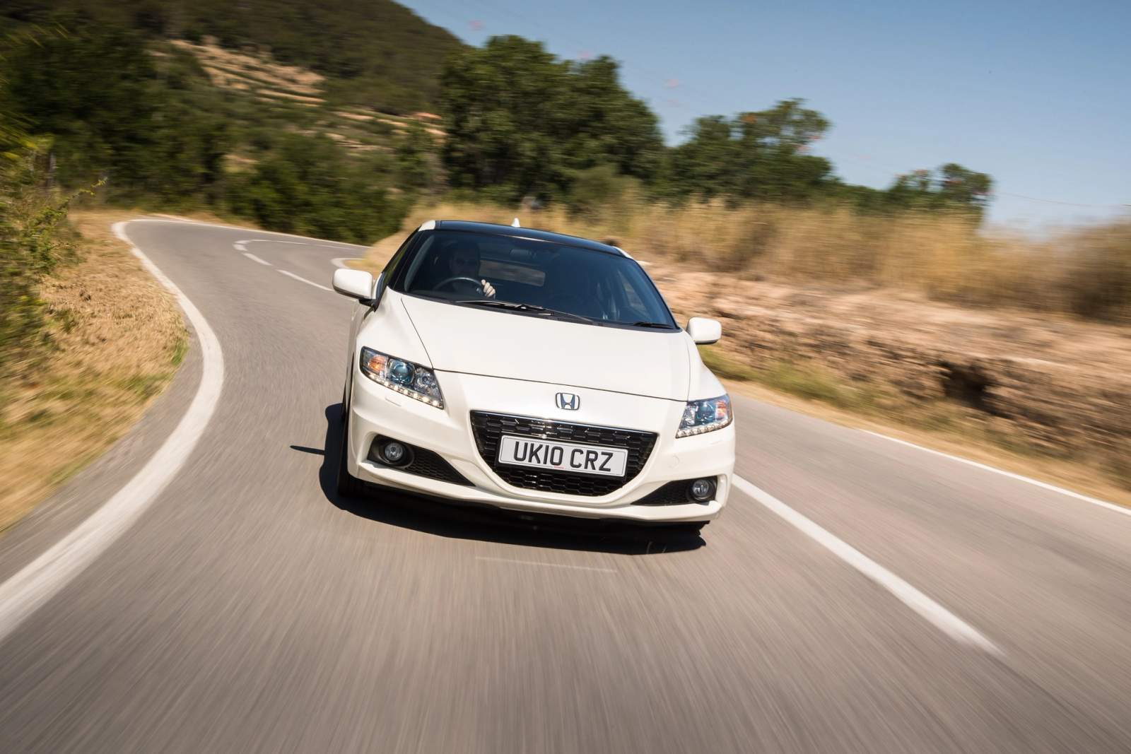 White Honda CR-Z driving