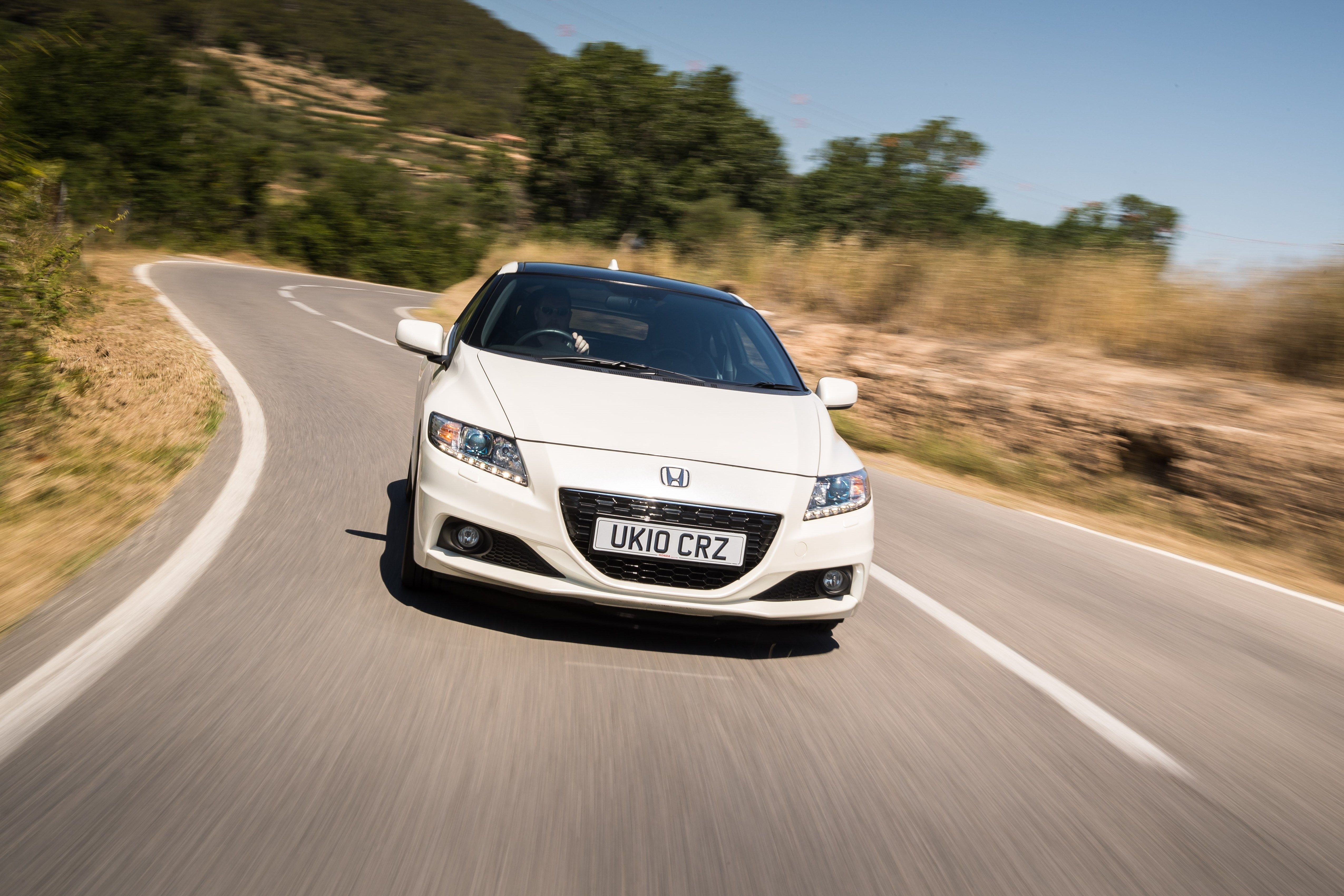 White Honda CR-Z driving