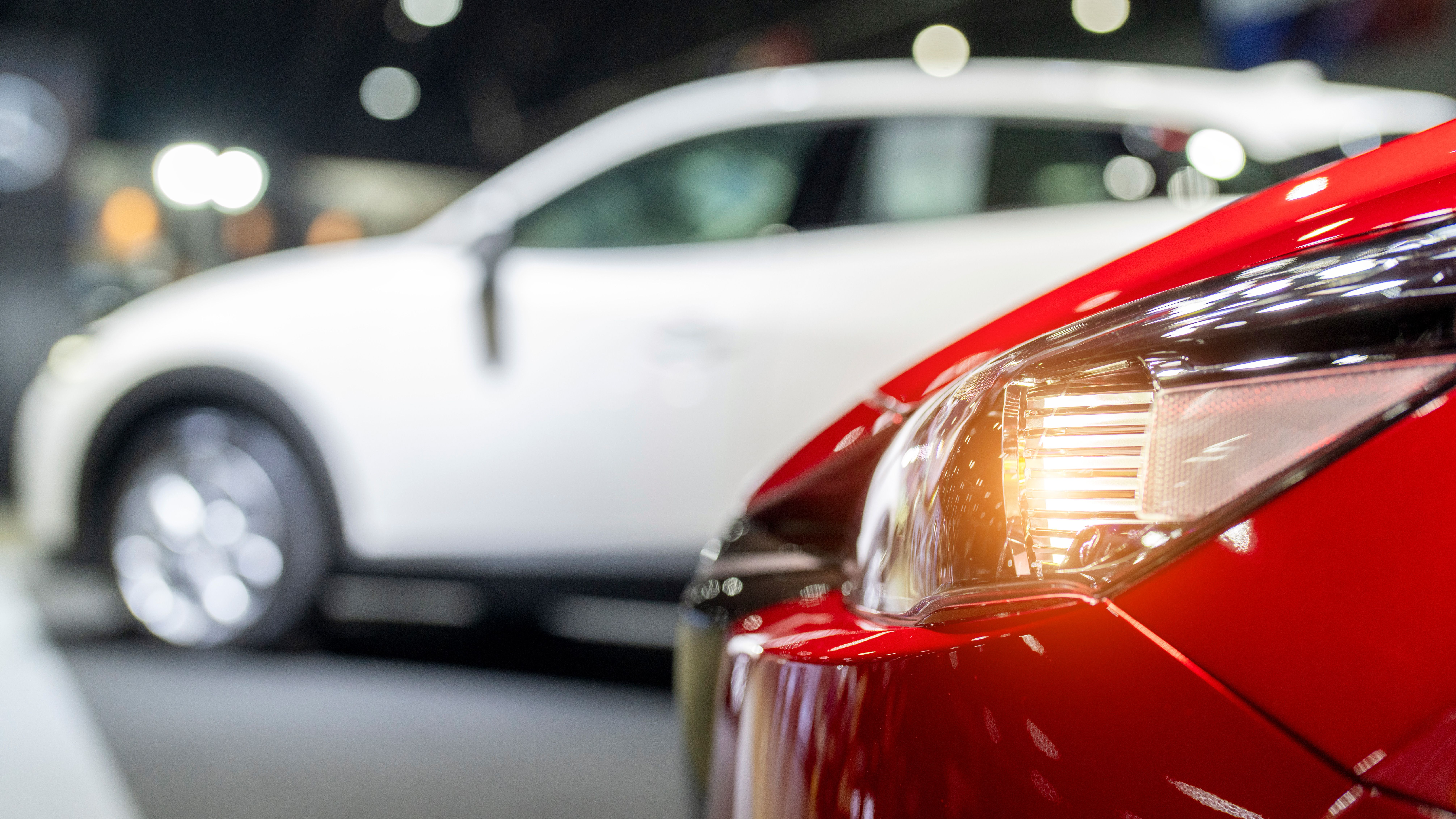 Nearly new white car in a dealership