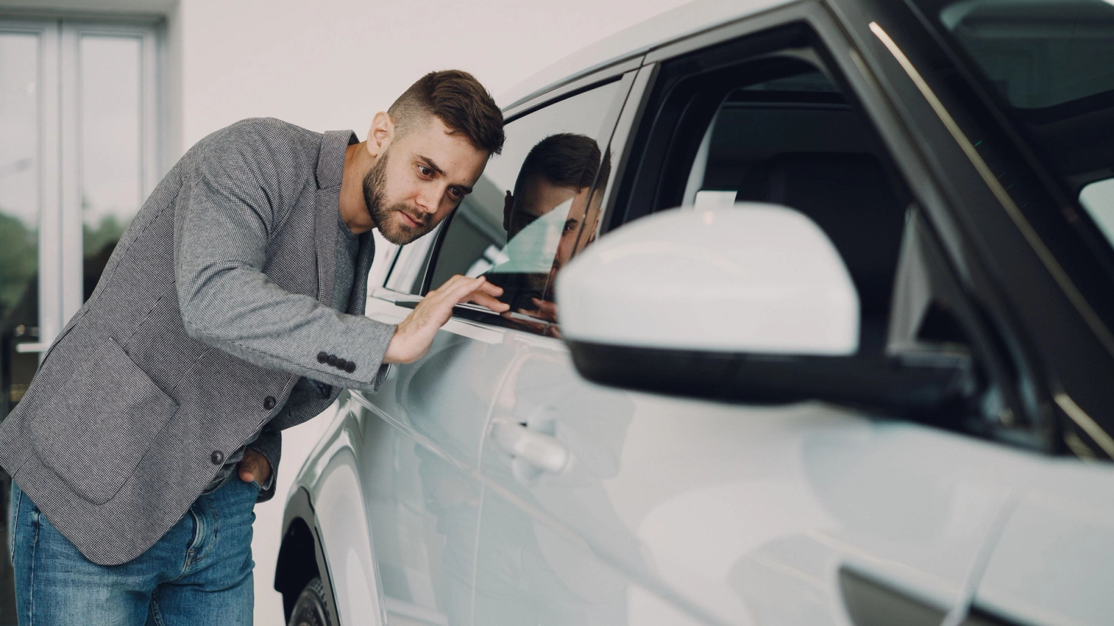 Man checking car 