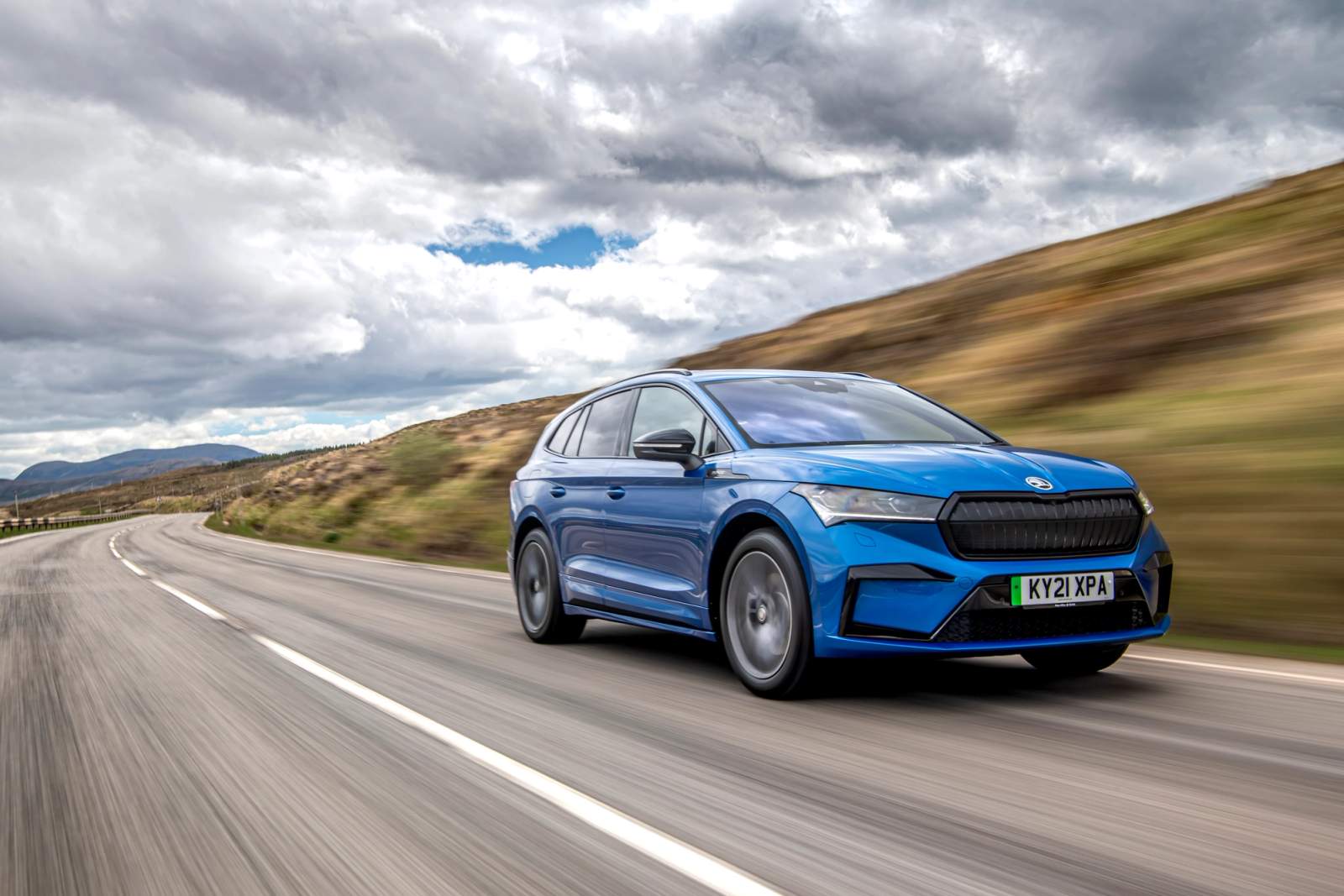 Blue Skoda Enyaq driving 