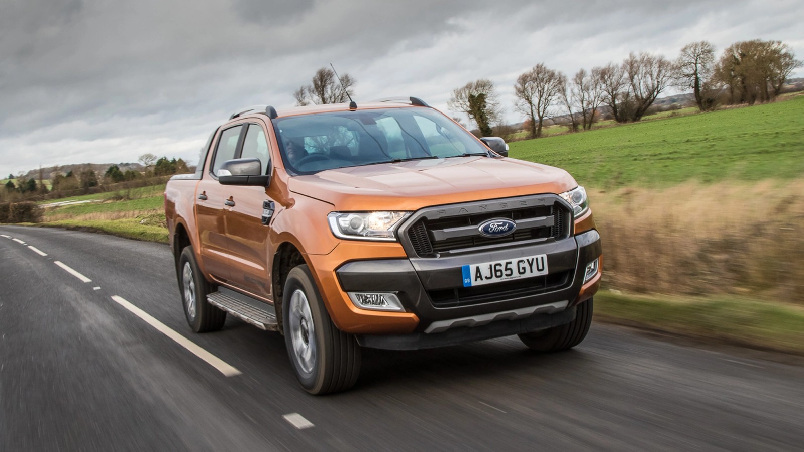 Orange Ford Ranger front driving
