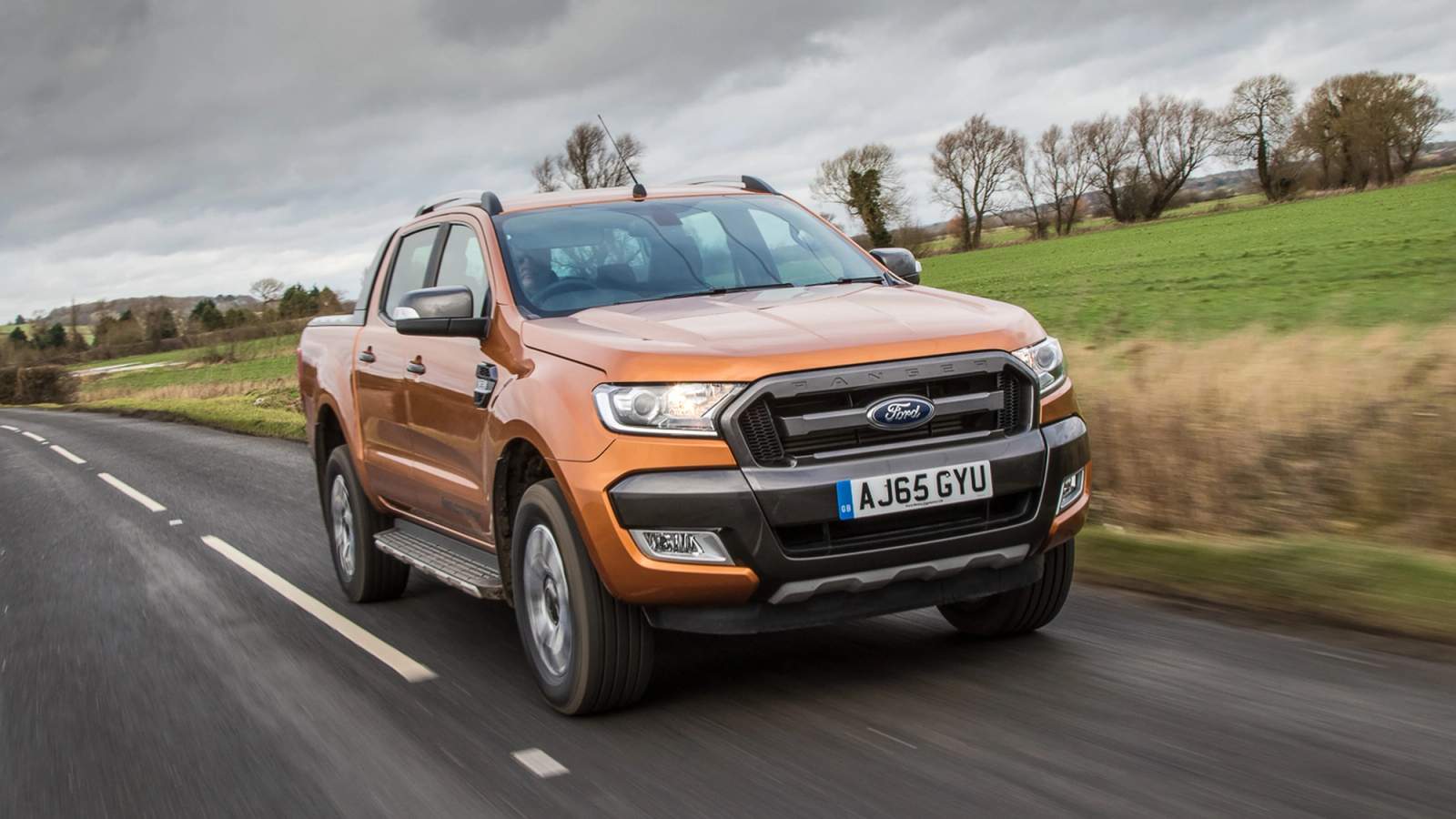 Orange Ford Ranger front driving