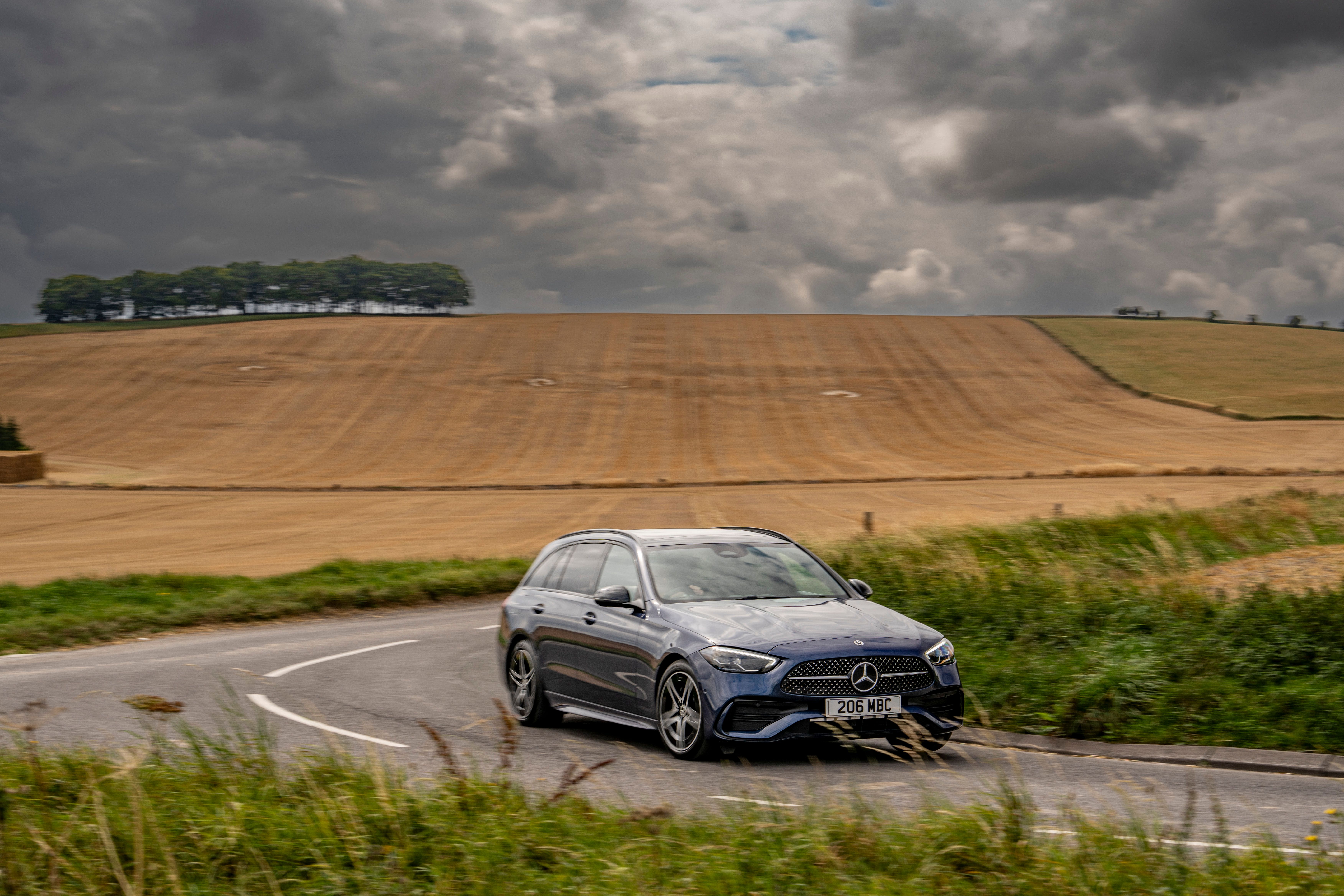 Blue Mercedes C-Class Estate driving