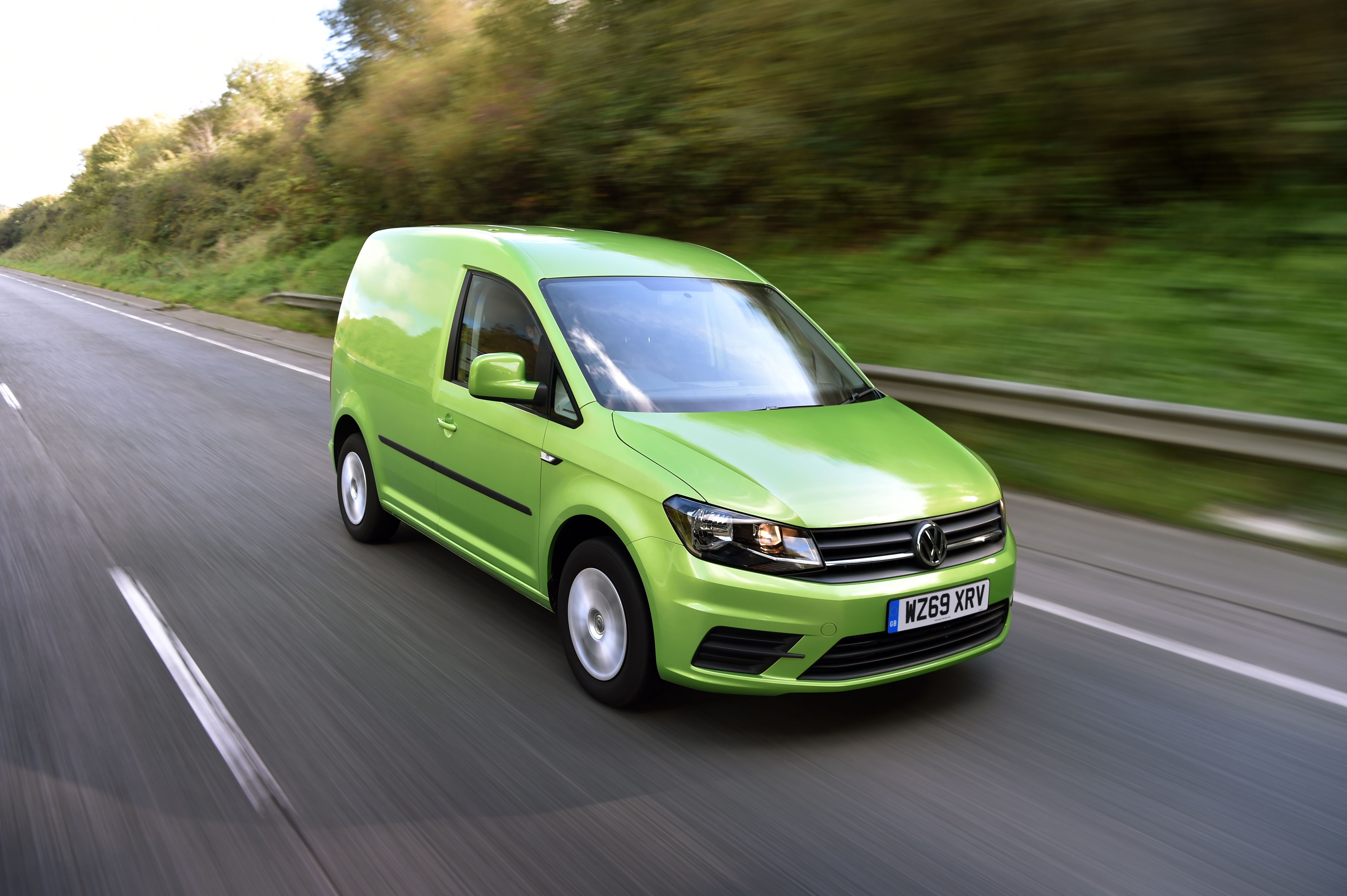 green van on road 