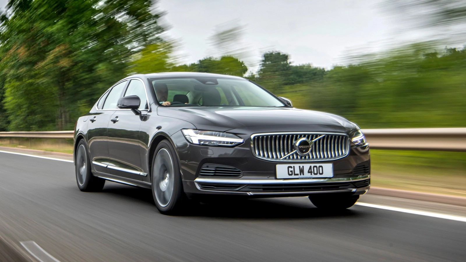 Brown Volvo S90 front driving