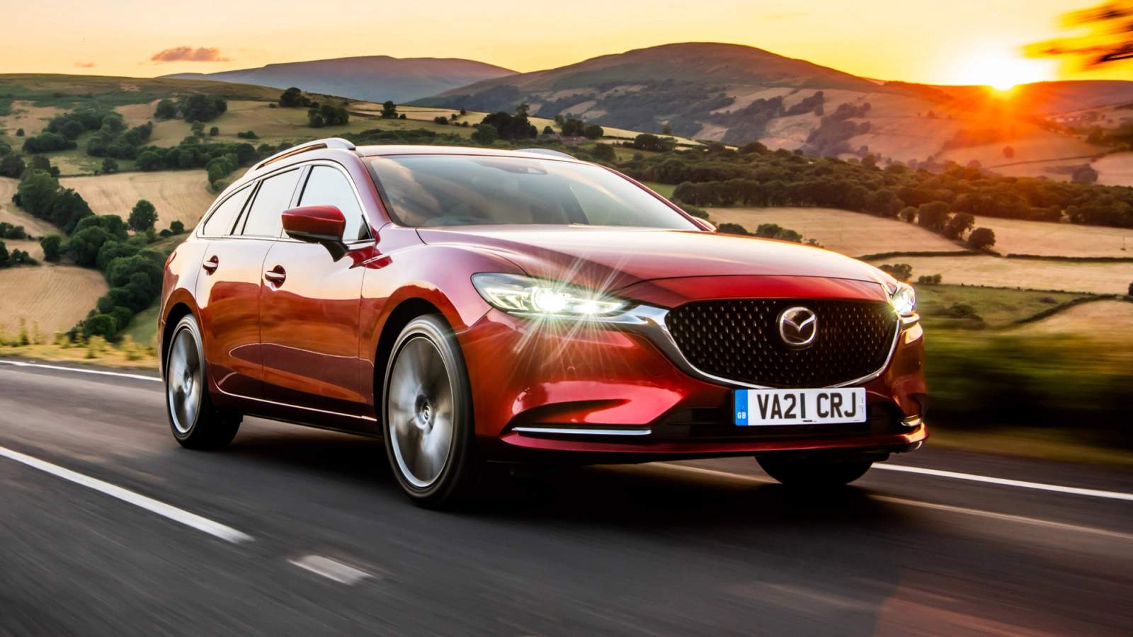 Red Mazda6 Tourer driving at sunset