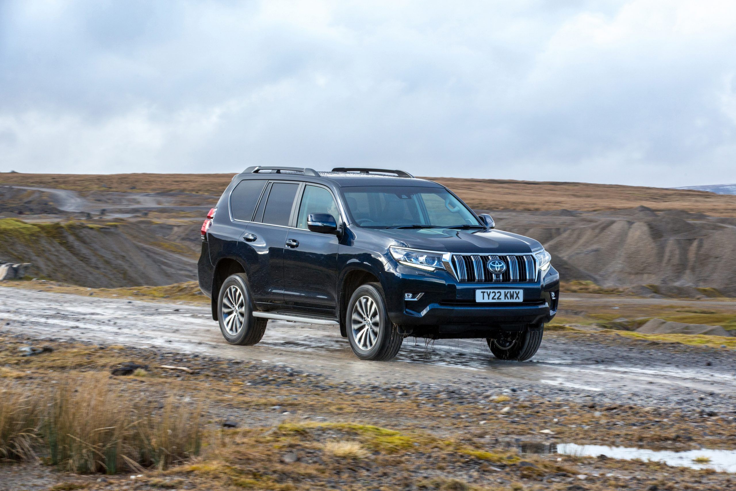 Blue Toyota Land Cruiser driving