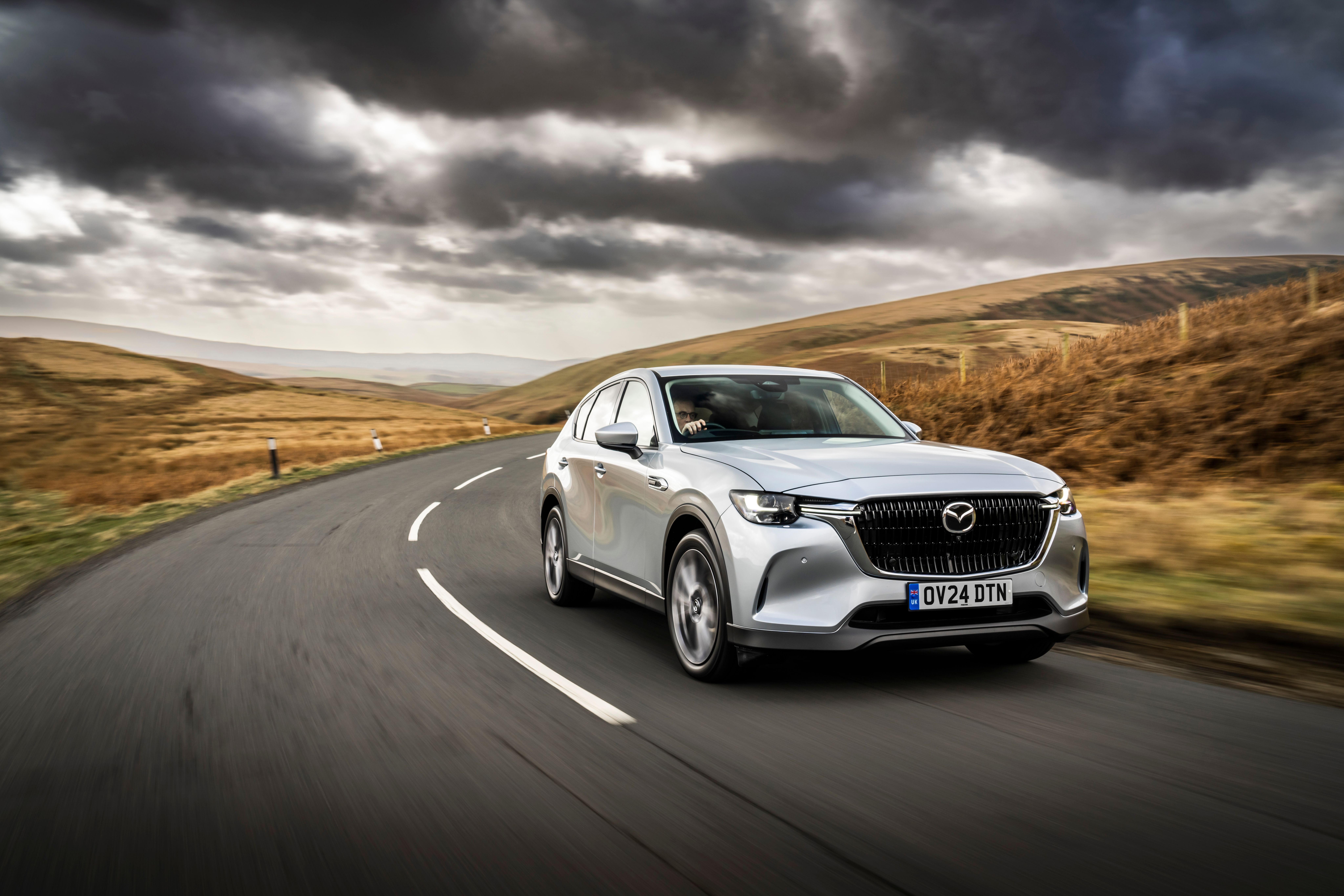 silver diesel suv on road