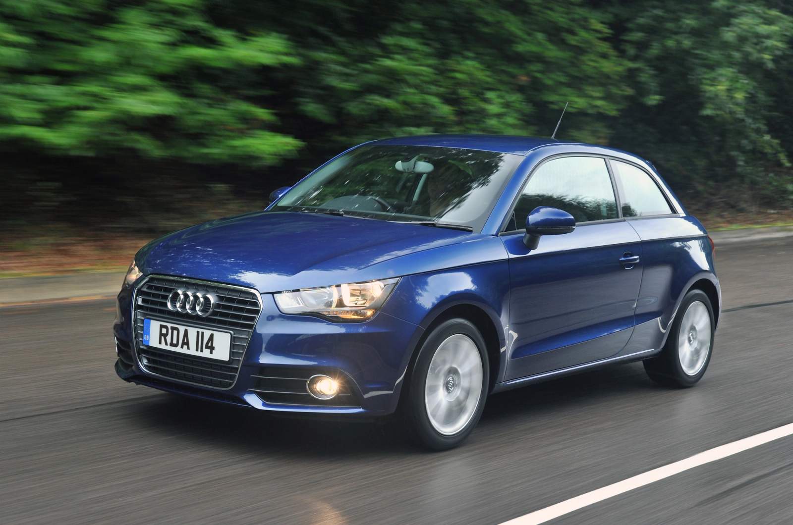 blue car on road