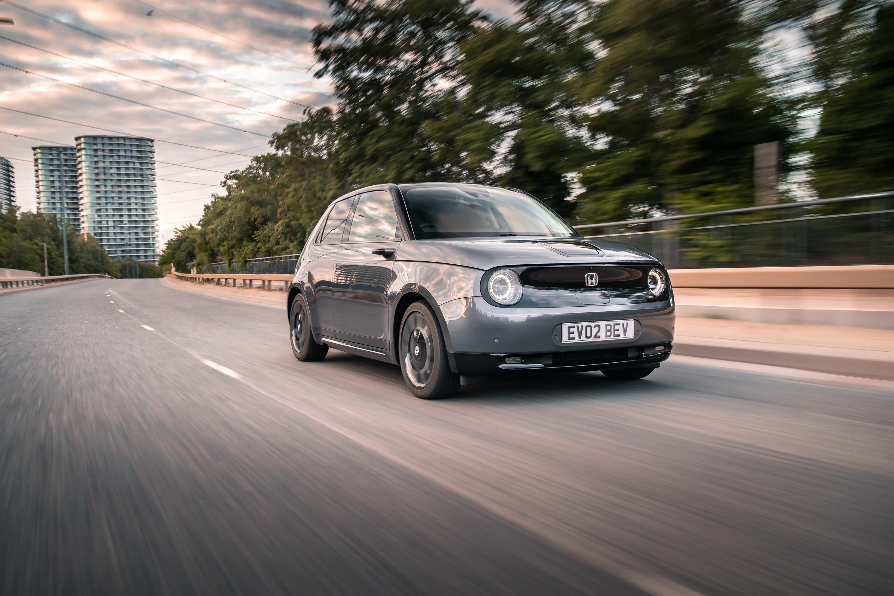 Grey Honda E driving