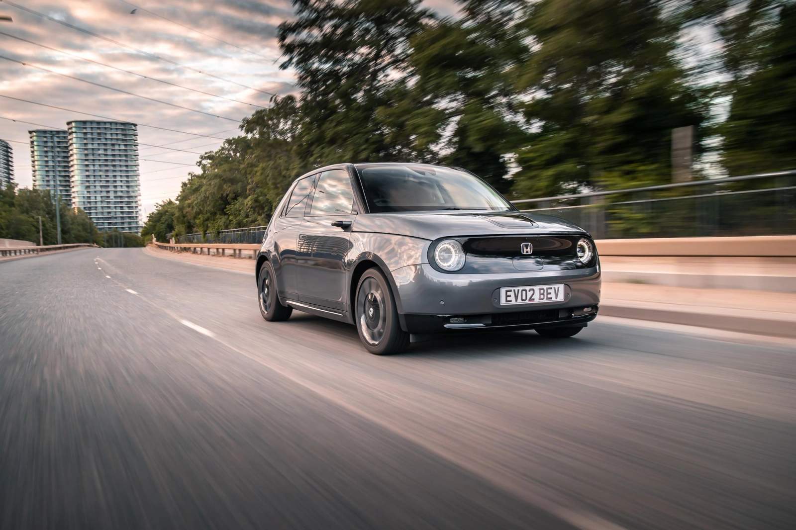 Grey Honda E driving