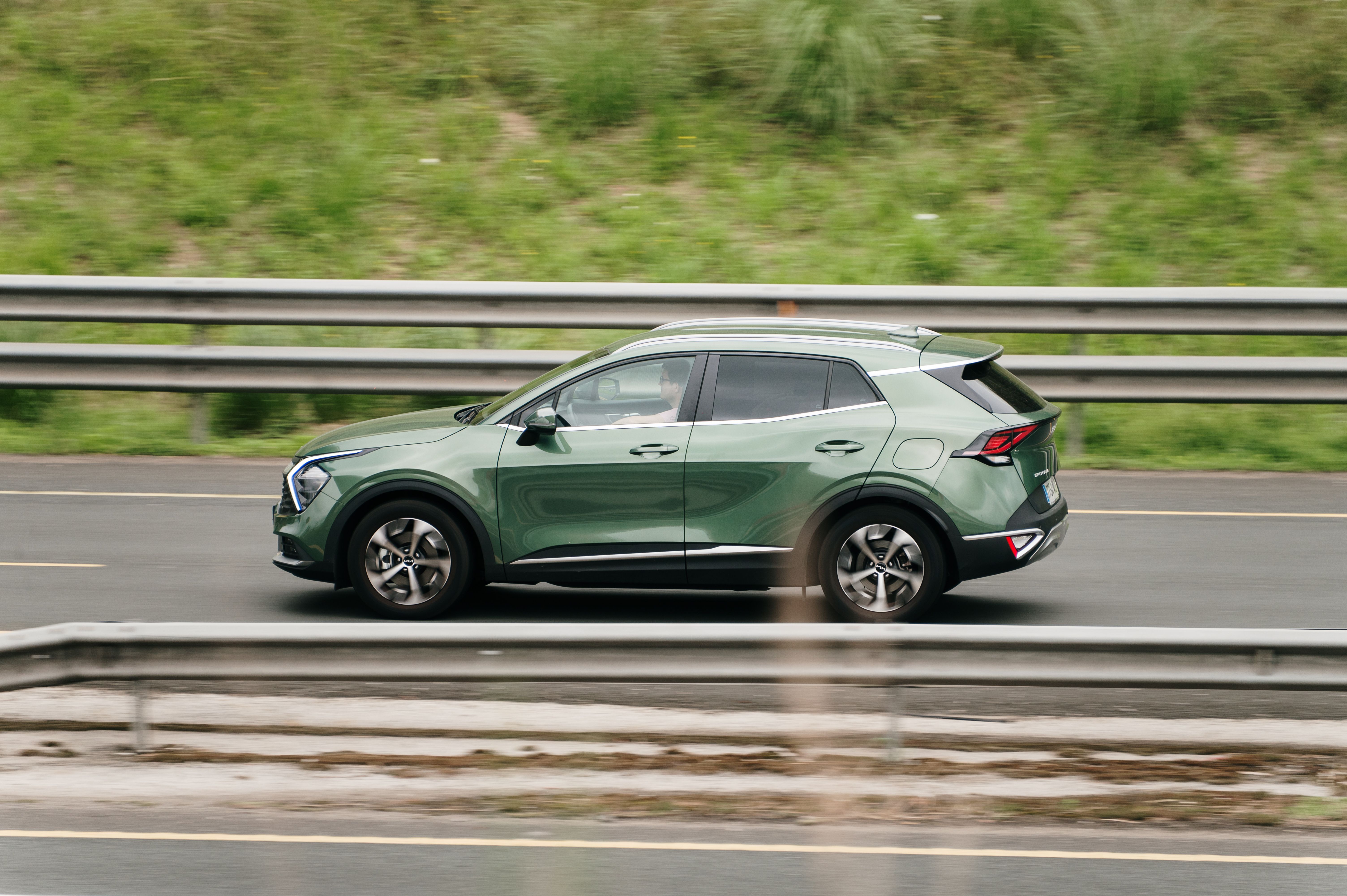 green car on the road
