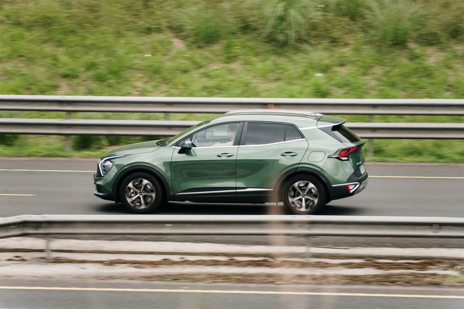 green car on the road