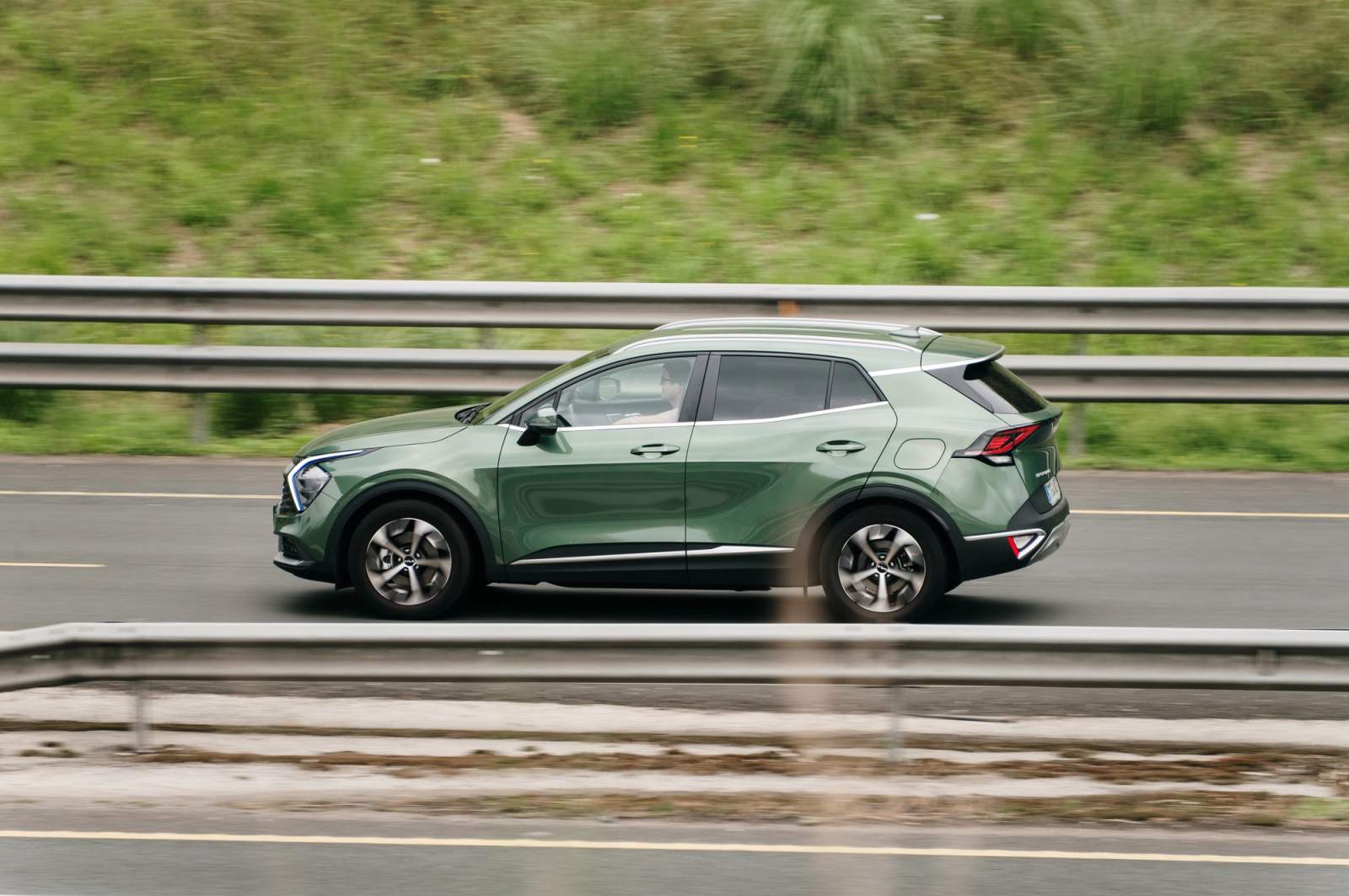 green car on the road