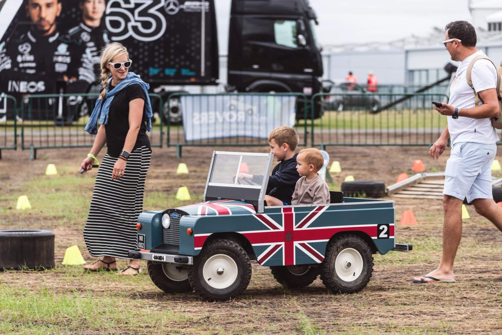 Mum and kids driving a small car